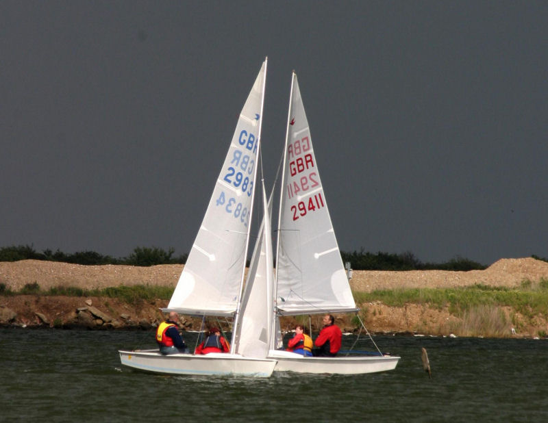 Race winners Alan Williams and Liz Crouch cross in front of Richard and Nicky Lambert during a Blue Circle Snipe open in 2006 photo copyright Richard Lambert taken at Blue Circle Sailing Club and featuring the Snipe class