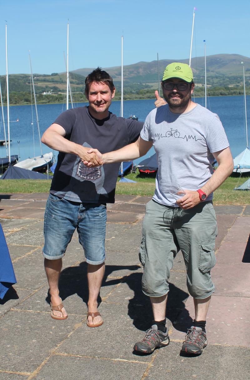 John Reekie is presented with his prize by and Commodore Robin Dawson at the Bassenthwaite Solo Open photo copyright William Carruthers taken at Bassenthwaite Sailing Club and featuring the Solo class