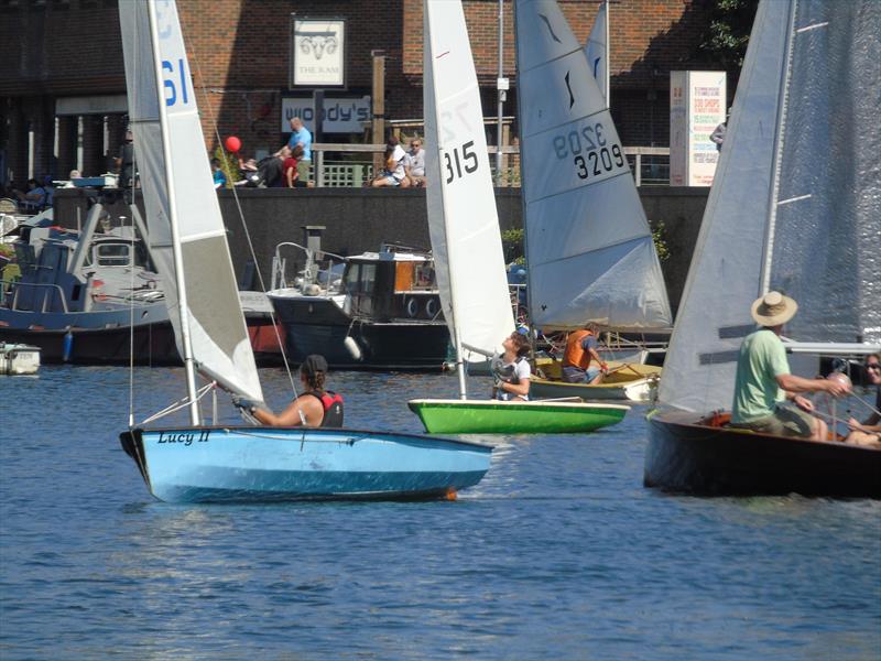 Class winners Erica Bishop (Blue Solo) and Ed Mayley (Green Laser) pass Nick Armfield's Merlin, with John Kemp's Solo (in the background) during the Minima Regatta 2018 photo copyright Rob Mayley taken at Minima Yacht Club and featuring the Solo class