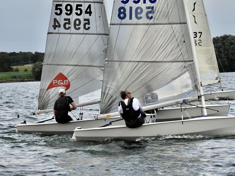 Race 2 winner Chris Brown sticks a tight cover on Oli Davenport during the Solo Inland Championship 2021 at Grafham Water - photo © Will Loy