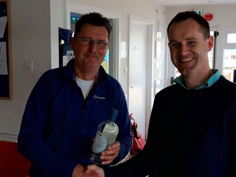 Shaun Welsh (left) very happy with his Chichester Gin spot prize at the Solo open meeting at Spinnaker photo copyright Shaun Welsh taken at Spinnaker Sailing Club and featuring the Solo class