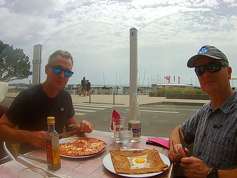 Solo Nation's Cup Build Up: Nigel Davies and Ian Firth enjoy the local pancakes and pizza photo copyright Will Loy taken at Yacht Club de Carnac and featuring the Solo class