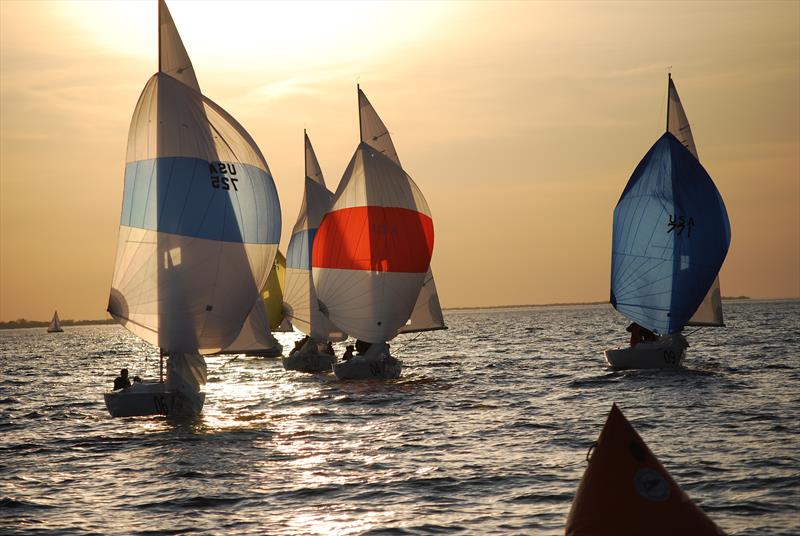 Sonars carrying kites in the setting sun photo copyright Rochester Yacht Club taken at Rochester Yacht Club and featuring the Sonar class