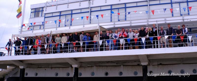 Competitors on the balcony of the Royal Corinthian Yacht Club during the Squib East Coast Championship 2022 photo copyright Roger Mant Photography taken at Royal Corinthian Yacht Club, Burnham and featuring the Squib class