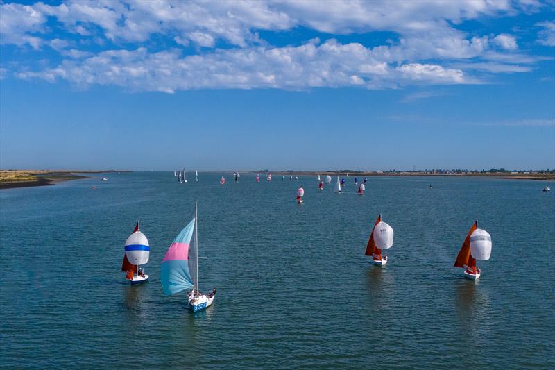 Close finish during Burnham Week 2024 photo copyright Petru Balau Sports Photography / sports.hub47.com taken at Royal Corinthian Yacht Club and featuring the Squib class