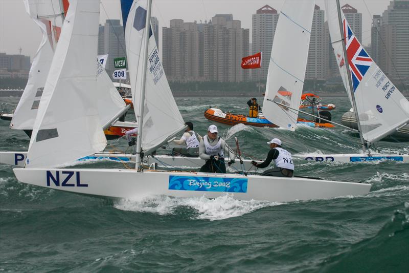 Finish of the Medal race for the Star class, Qingdao 2008 photo copyright Richard Gladwell taken at Qingdao Olympic Sailing Center and featuring the Star class