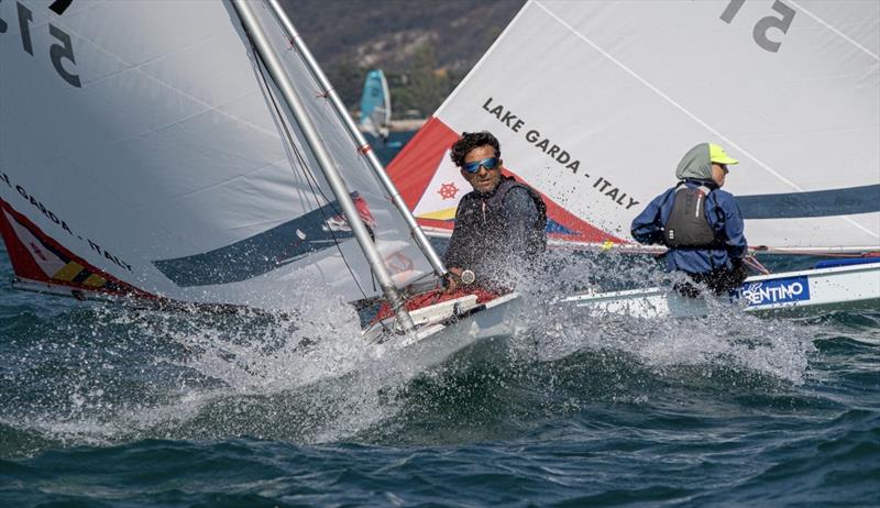 2022 Sunfish World Championship day 2 photo copyright Elena Giolai taken at Circolo Vela Torbole and featuring the Sunfish class