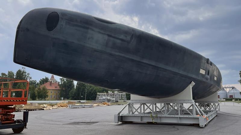 The all carbon/Nomex hull being prepared for coating. Note the pronounced chine and side arm apertures indicating the position of the hydraulically operated, T-shaped hydrofoils - photo © Baltic Yachts