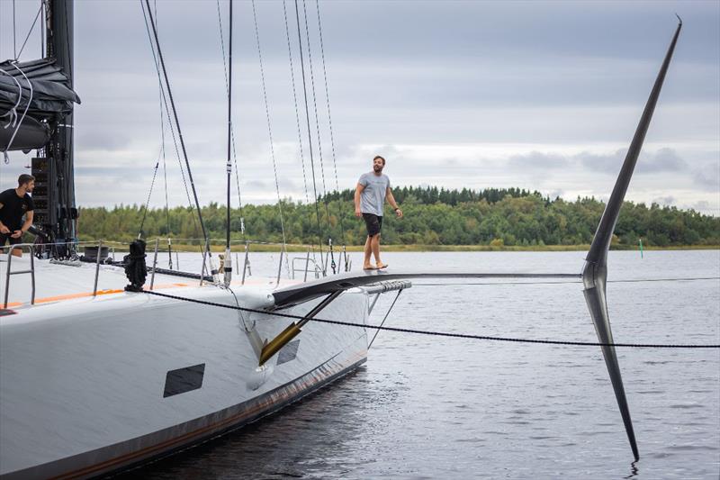 Baltic 111 Custom foil-assisted superyacht 'Raven' - Wing-walking with a difference – a Raven crew member checks out the yacht's extraordinary starboard side arm and hydrofoil prior to trials - photo © Eva-Stina Kjellman