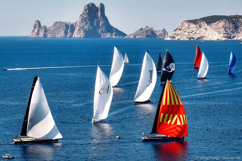 Ibiza JoySail Day 4: Aerial image of the Superyachts with Es Vedrà in the background photo copyright Sailing Energy taken at  and featuring the Superyacht class