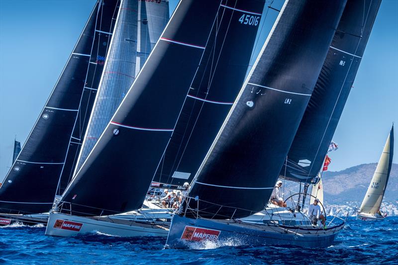 Swing Cube (centre) new leader in the Swan 45 class on day 2 at 38 Copa del Rey MAPFRE photo copyright Nico Martínez / Copa del Rey MAPFRE taken at Real Club Náutico de Palma and featuring the Swan class