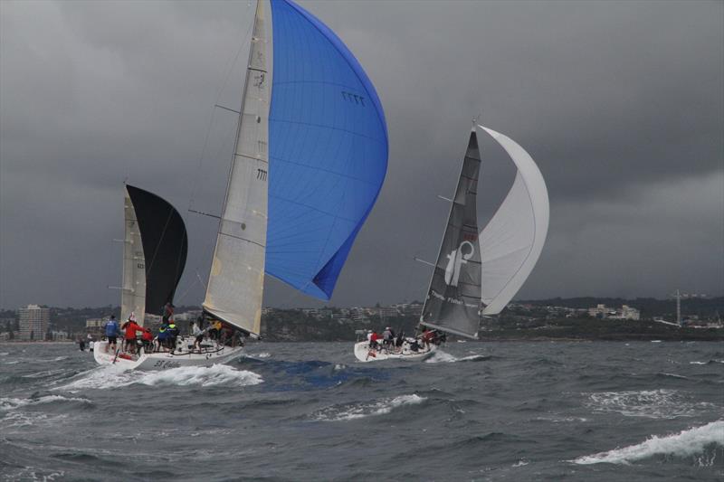 Hard downwind as rain approaches on day 1 of the Sydney 38 OD International Championship photo copyright Tim Vine / Yoti taken at Middle Harbour Yacht Club and featuring the Sydney 38 class