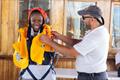 RCYC Student Ovayo Myira displaying essential safety wear aboard the Nave Italia © Merlo Fotografia