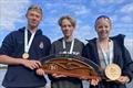 Merryn Attridge, Sarah Davis and Tom Thwaites of Royal Hospital School win the National School Sailing Association Singlehanded Team Racing Championships