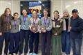 RHS Blue win the RYA Women's Team Racing Championship - Daisy Adams, Abbey Penny, Anna Edmonds, Sarah Davis (captain), Scarlett MacLennan and Sophia Hiller, with RHS Headmaster Irfan Latif and his wife Jo