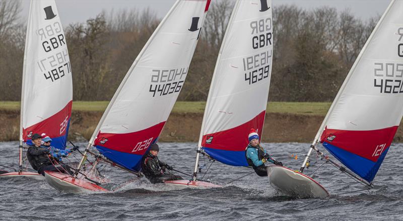 Very close racing on the first beat during Round 7 of the Midlands 2021-2022 Topper Traveller Series at Notts County SC photo copyright David Eberlin taken at Notts County Sailing Club and featuring the Topper class