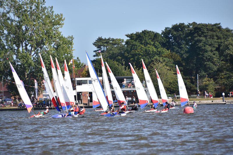 Leading Topper about to call “Water for Pontoons” as the fleet approaches clubhouse - 28th Broadland Youth Regatta photo copyright Trish Barnes taken at Waveney & Oulton Broad Yacht Club and featuring the Topper class