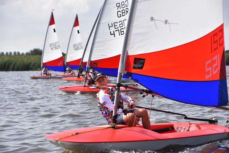 The largest fleet, Toppers, sets off from a start - 28th Broadland Youth Regatta photo copyright Trish Barnes taken at Waveney & Oulton Broad Yacht Club and featuring the Topper class