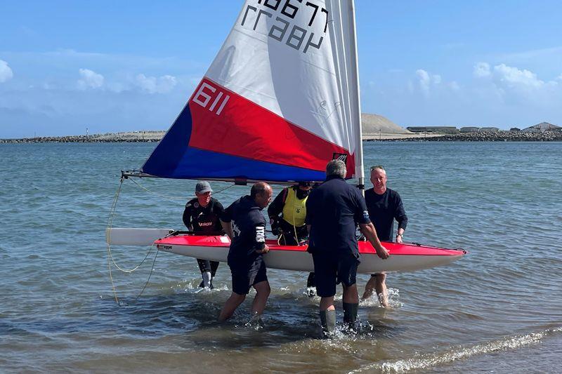 Welcoming Party - Jessica Powell wins the GJW Direct Topper UK National Championships photo copyright Michael Powell taken at Plas Heli Welsh National Sailing Academy and featuring the Topper class