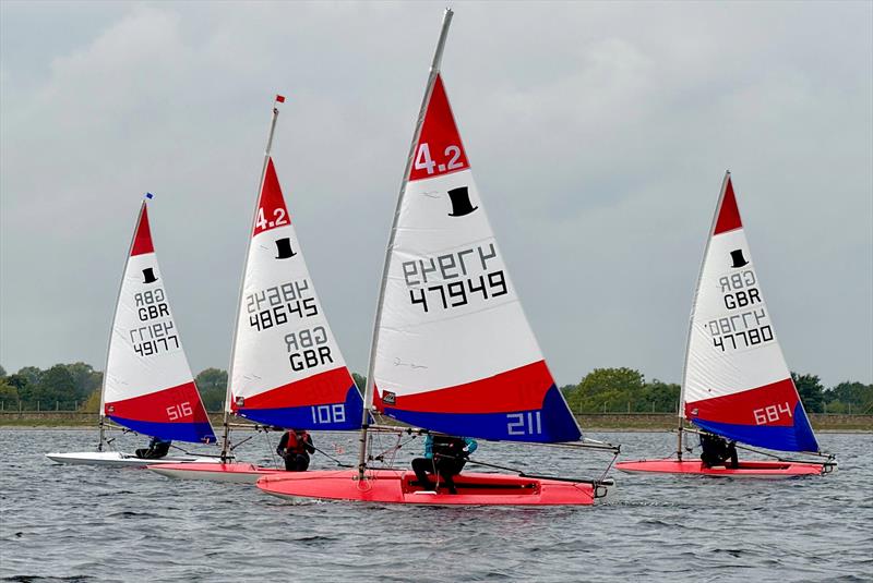 Event winner Sam Dence leads two 4.2s and Jack Taylor in a 5.3 - South East Topper series at Island Barn for the Tom Howard Trophy photo copyright Chloe Tollit taken at Island Barn Reservoir Sailing Club and featuring the Topper 4.2 class