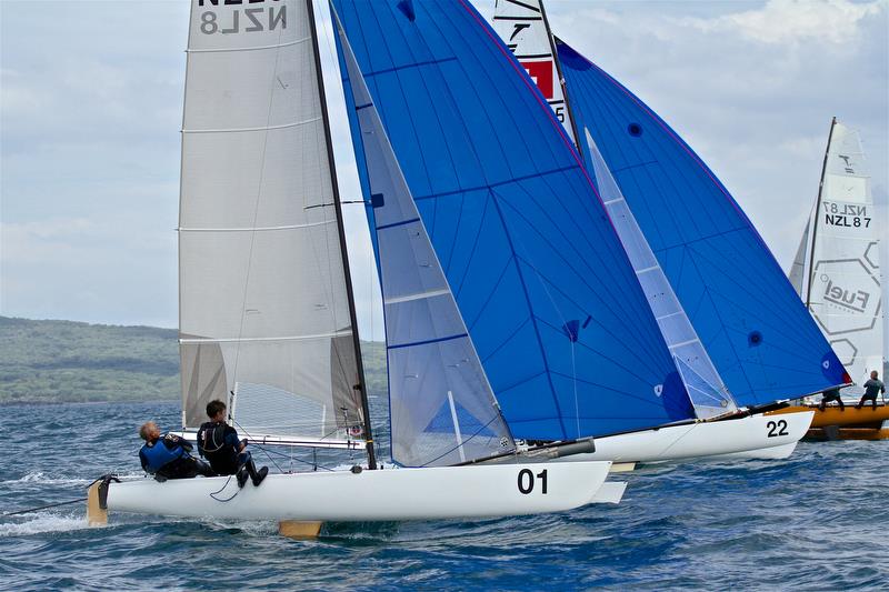 Brett and Rex Sellers (NZL) battle with Jorg Steiner and Michael Gloor (SUI) for the lead in Race 10 - Int Tornado Worlds - Day 5, presented by Candida, January 10, 2019 photo copyright Richard Gladwell taken at Takapuna Boating Club and featuring the Tornado class
