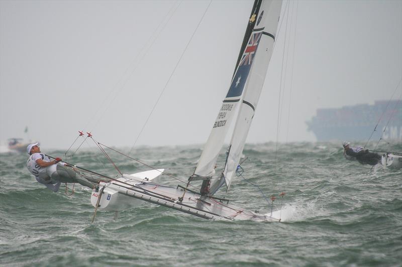 Darren Bundock and Glenn Ashby (AUS) power upwind - Medal race for the Tornado class, Qingdao 2008 - photo © Richard Gladwell