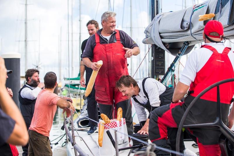 Skipper Mick Martin breaking bread with his winning team photo copyright Bryan Gauvan taken at Cruising Yacht Club of Australia and featuring the TP52 class