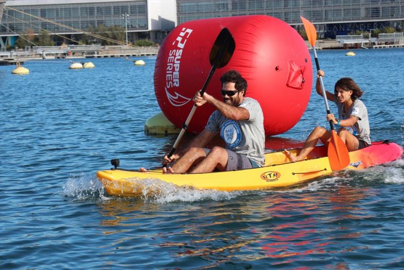 Bart's Bash fun in Valencia for the TP52 fleet (kayak race won by America's Cup grinder Shannon Falcone) photo copyright 52 SUPER SERIES taken at  and featuring the TP52 class