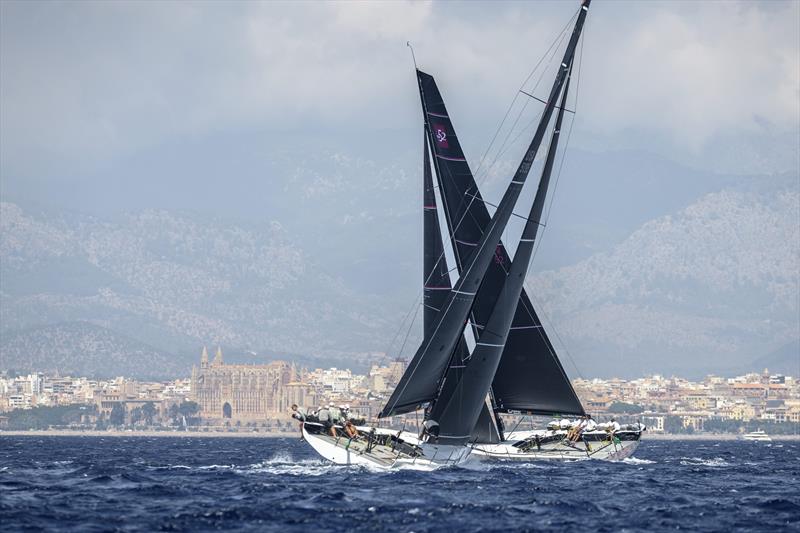 Takashi Okura's Sled (United States) and Harm Müller-Spreer's Platoon (Germany) wail with The Cathedral of Santa Maria of Palma in their sights photo copyright Kurt Arrigo / Rolex taken at  and featuring the TP52 class