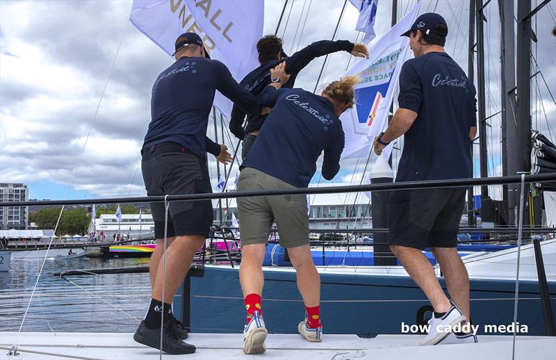 That'd be Jack Macartney getting assisted to step off photo copyright Bow Caddy Media taken at Cruising Yacht Club of Australia and featuring the TP52 class