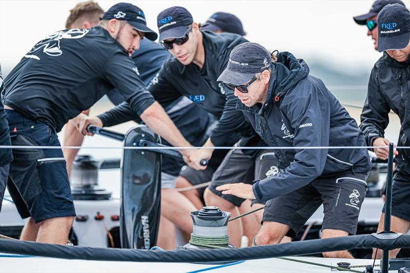 Close view of Smuggler crew work during day 2 of 2023 Pallas Capital TP52 Gold Cup Act 2 photo copyright Salty Dingo / SailFest Newcastle taken at Newcastle Cruising Yacht Club and featuring the TP52 class