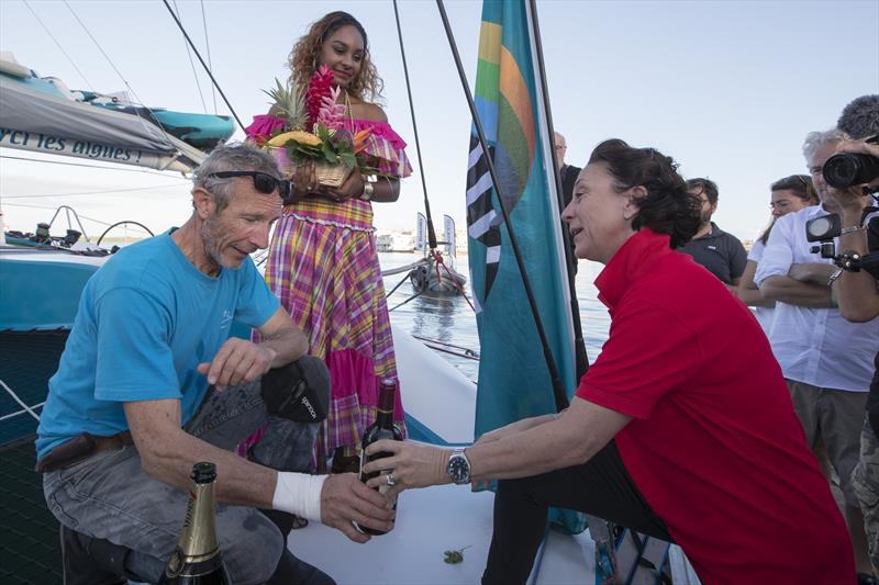The wife of Lalou offers a bottle of wine to Antoine to thank him for picking up her husband after he capsized in his Multi 50 before being transferred to a tug in the Route du Rhum-Destination Guadeloupe - photo © Alexis Courcoux 