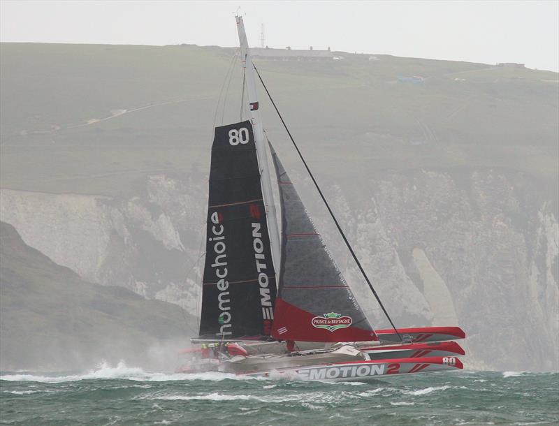 UltimEmotion2 passes Hurst Castle after the Rolex Fastnet Race start photo copyright Mark Jardine taken at Royal Ocean Racing Club and featuring the Trimaran class