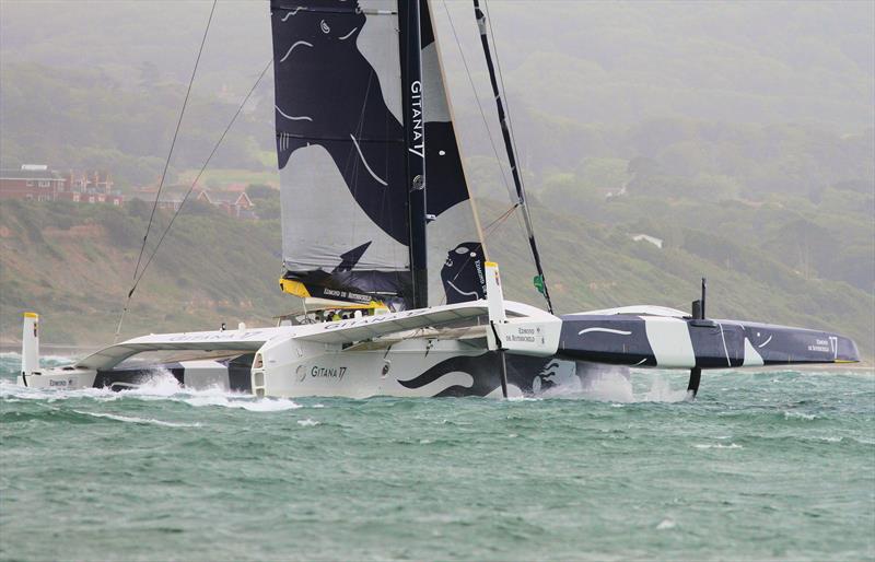 Maxi Edmond de Rothschild passes Hurst Castle after the Rolex Fastnet Race start photo copyright Mark Jardine taken at Royal Ocean Racing Club and featuring the Trimaran class