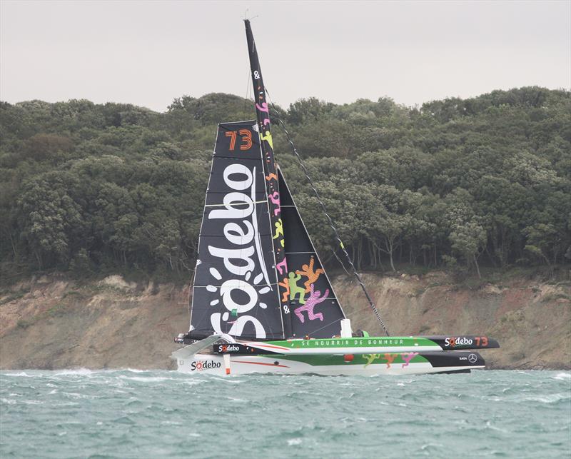 Sodebo passes Hurst Castle after the Rolex Fastnet Race start - photo © Mark Jardine