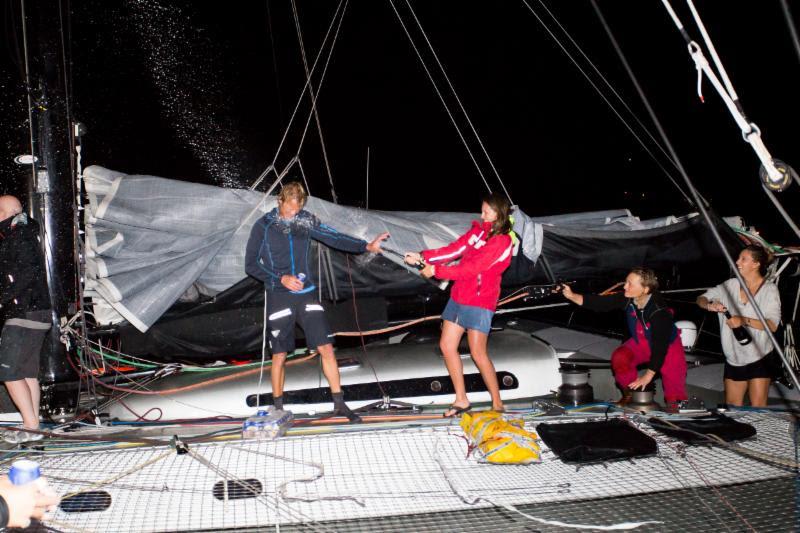 After taking Multihull Line Honours; celebrations on board Paradox - photo © RORC / Arthur Daniel
