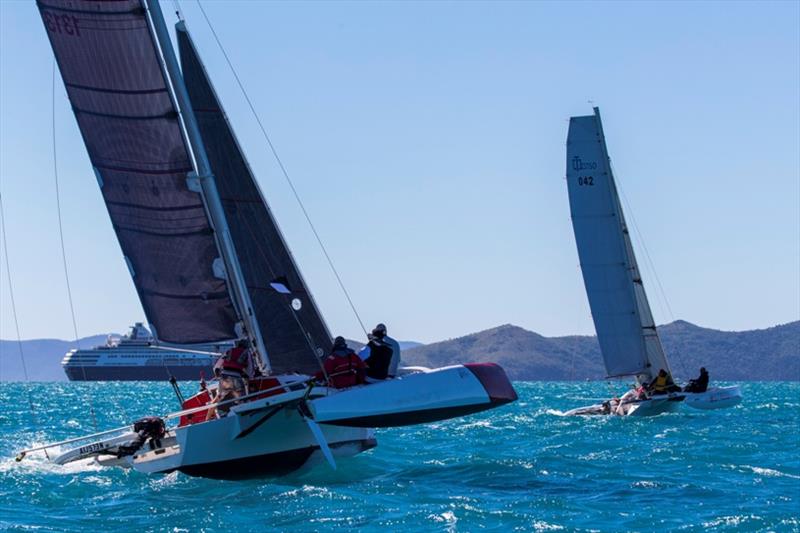 Evil Gnome chasing down Mistress - 2019 Airlie Beach Race Week photo copyright Andrea Francolini / ABRW taken at Whitsunday Sailing Club and featuring the Trimaran class