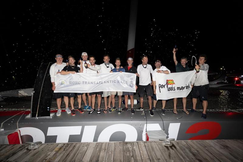 Dockside celebrations at Camper & Nicholsons Port Louis Marina for the crew on Antoine Rabaste's Maxi Multihull Ultim'emotion 2 (FRA). The team were welcomed by Nikoyan Roberts, Manager, Nautical Development at Grenada Tourism Authority  - photo © Arthur Daniel/  RORC