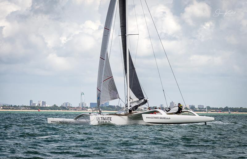 Sailing up the Eastern end of the Solent during the Round the Island Race 2022 photo copyright Sam Kurtul / www.worldofthelens.co.uk taken at Island Sailing Club, Cowes and featuring the Trimaran class