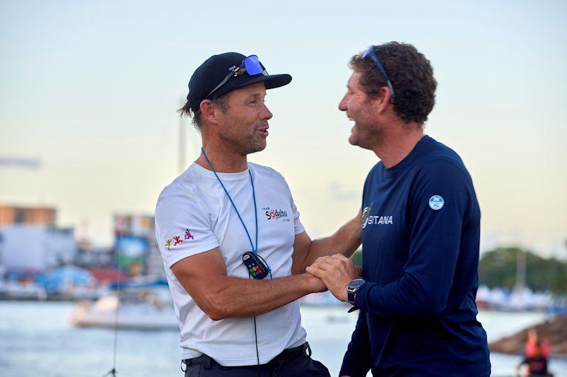 Thomas Coville congratulates Charles Caudrelier after the 12th Route du Rhum-Destination Guadeloupe photo copyright Arnaud Pilpré taken at  and featuring the Trimaran class