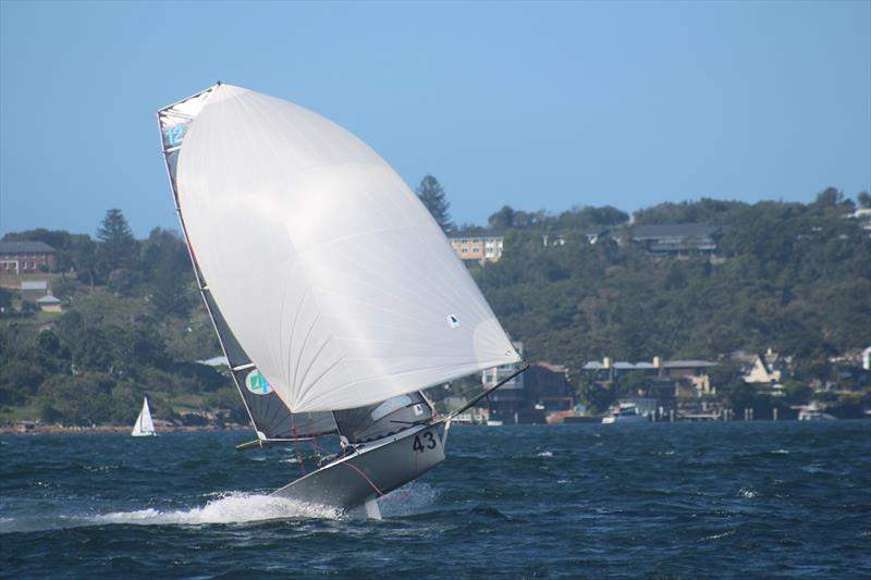 Sydney Sailmakers lifts off - 12ft Skiff Upper Harbour Championship photo copyright Vita William taken at Lane Cove 12ft Sailing Skiff Club and featuring the 12ft Skiff class
