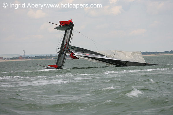 A spectacular capsize for Tommy Hilfiger during the Portsmouth VX40 Grand Prix photo copyright Ingrid Abery / www.hotcapers.com taken at  and featuring the  class