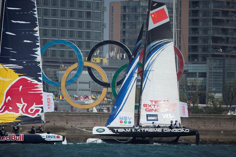 Team Extreme Qingdao race past the Olympic rings in 2014 photo copyright Lloyd Images taken at  and featuring the Extreme 40 class