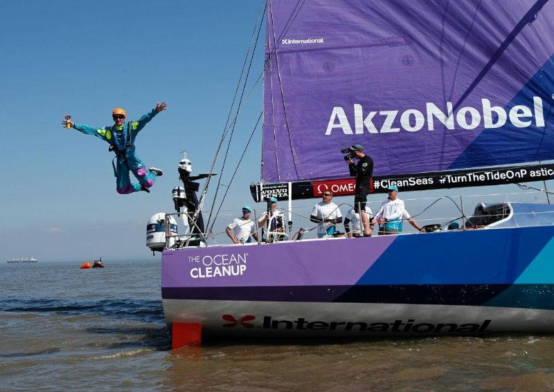 AkzoNobel employee and team AkzoNobel super-fan Andrew Grieve makes a spectacular leap from the yacht's stern prior to the start of Volvo Ocean Race Leg 10 photo copyright Thierry Martinez / team AkzoNobel taken at  and featuring the Volvo One-Design class