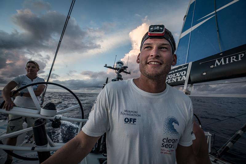 Henry Bomby enjoying the start of his off watch by watching the sun rise during Volvon Ocean Race Leg 8 from Itajai to Newport, day 9 on board Turn the Tide on Plastic photo copyright James Blake / Volvo Ocean Race taken at  and featuring the Volvo One-Design class