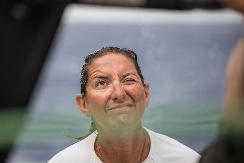 Leg 4, Melbourne to Hong Kong, Day 10 onboard Turn the Tide on Plastic. Dee Caffari leaning a hand during a peel in a morning squall. - photo © Brian Carlin / Volvo Ocean Race