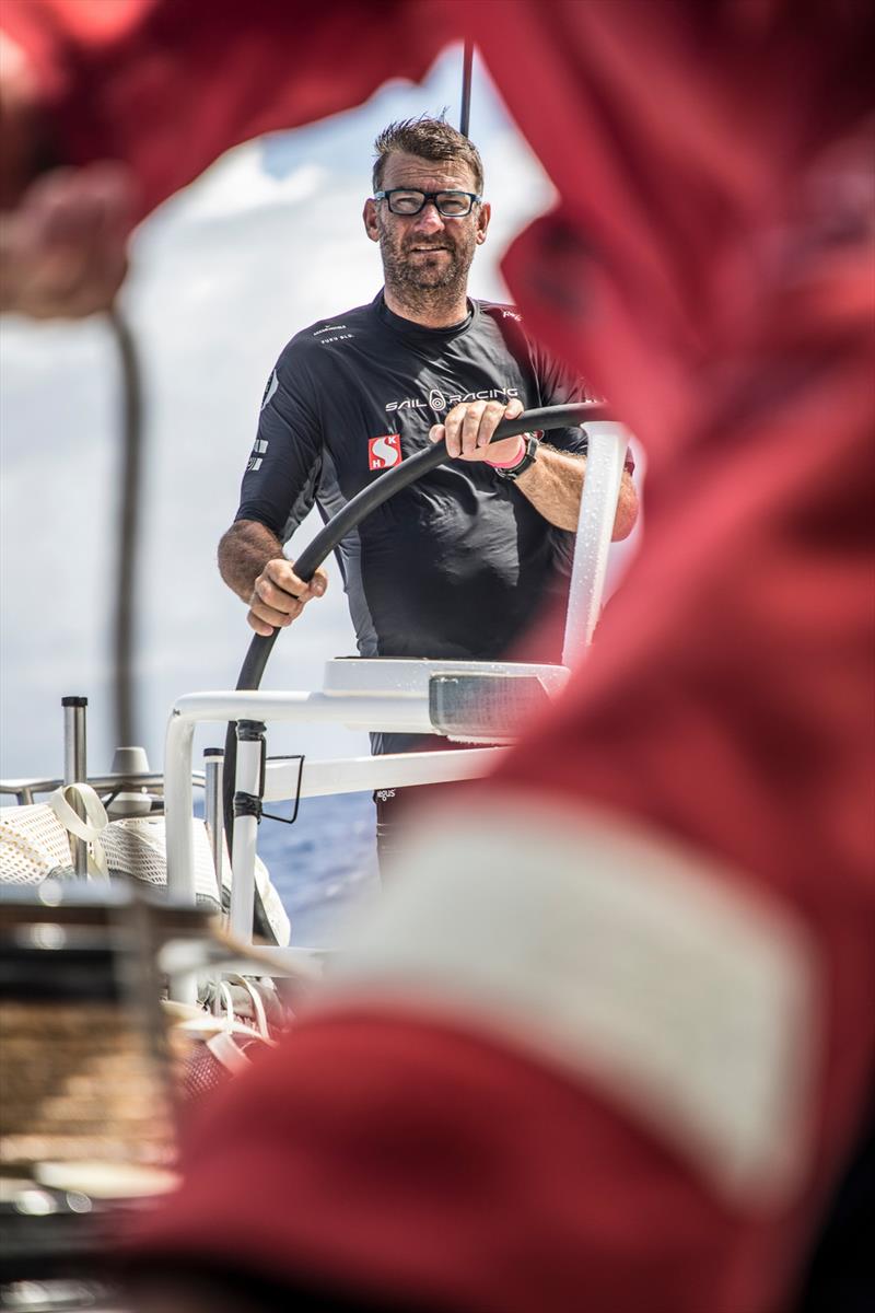 Leg 4, Melbourne to Hong Kong, day 15 David Witt takes the wheel during a manoeuvre on board Sun Hung Kai / Scallywag photo copyright Konrad Frost / Volvo Ocean Race taken at  and featuring the Volvo One-Design class