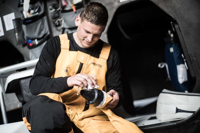 Leg 6 to Auckland, day 4 on board Turn the Tide on Plastic. Henry Bomby fixing a wrist seal broken a few watches ago. 10 February,  2018 photo copyright James Blake / Volvo Ocean Race taken at  and featuring the Volvo One-Design class