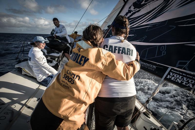 Leg 6 to Auckland, Day 7 on board Turn the Tide on Plastic. When the wet bowman gives the dry helmsman a soggy hug- Liz Wardley and Dee Caffari. 13 February,  photo copyright James Blake / Volvo Ocean Race taken at  and featuring the Volvo One-Design class