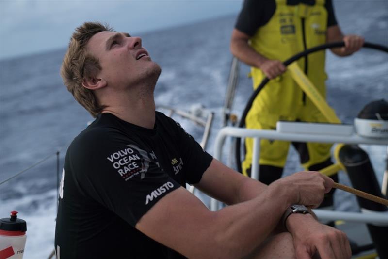 Volvo Ocean Race Leg 6 to Auckland, day 12 on board Brunel. Kyle Langford holding the main sail on a nice and quiet evening. 18 February photo copyright Yann Riou / Volvo Ocean Race taken at  and featuring the Volvo One-Design class